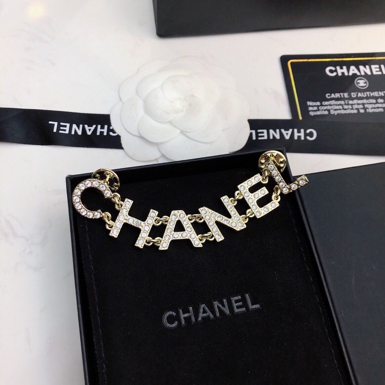 Ch*el brooches